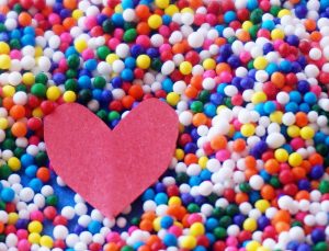 paper heart with multicoloured background