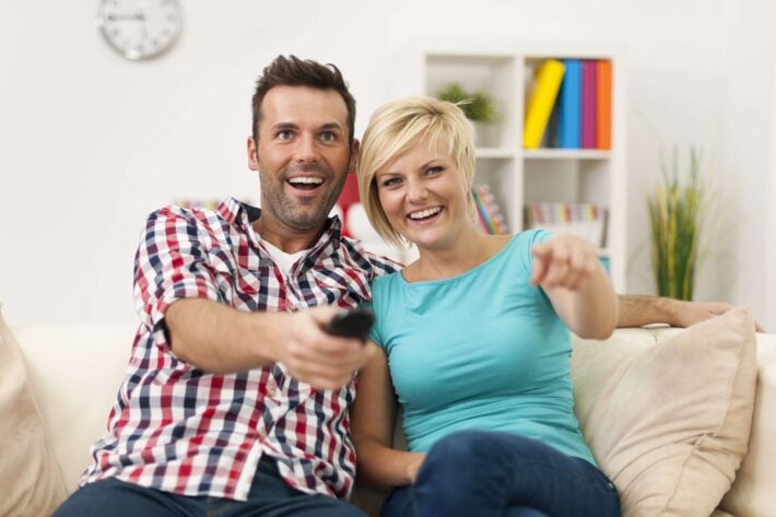 Couple watching shows and movies to learn English at home