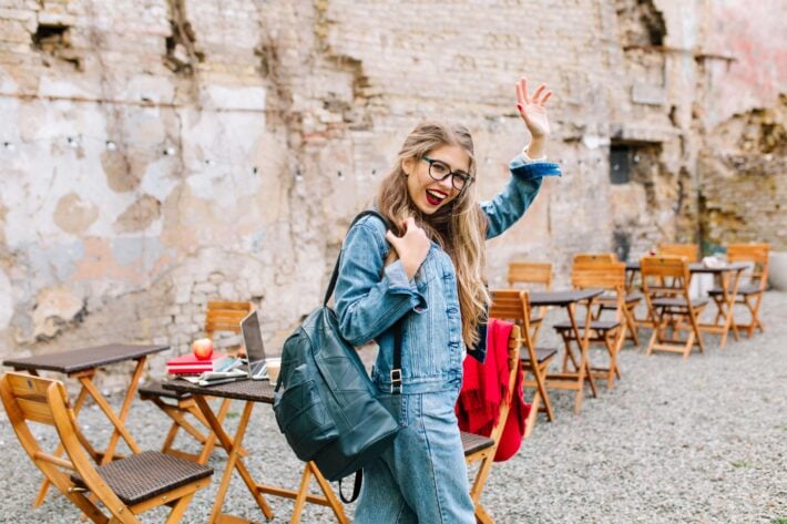 Blond female student saying goodbye in Indonesian