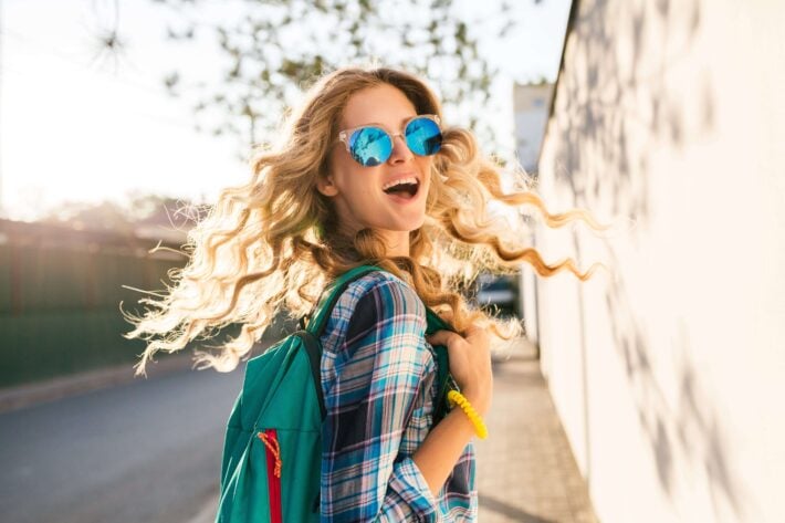 Blond female tourist using Indonesian greetings in her travels