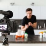 happy-young-man-filming-his-video-blog-episode-min-150x150.jpg