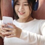 asian-woman-watching-video-clip-from-phone-min-150x150.jpg
