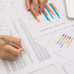 A businessperson drawing charts which show English punctuation
