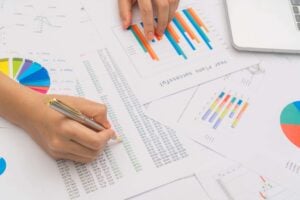 A businessperson drawing charts which show English punctuation