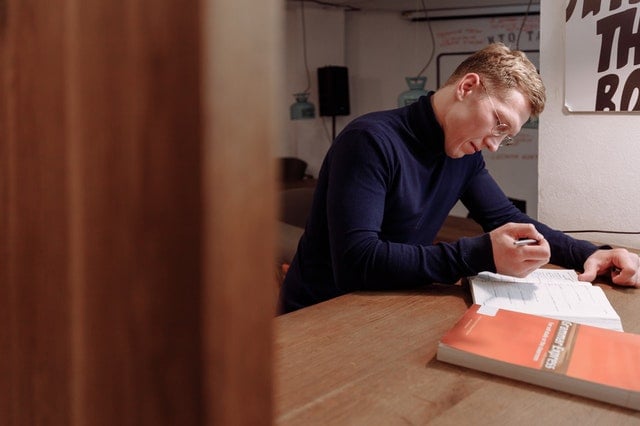 Picture of a man studying French punctuation